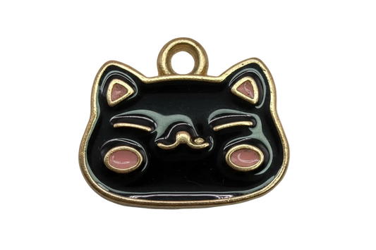Glossy black sleepy cat face with gold outline and pink accents