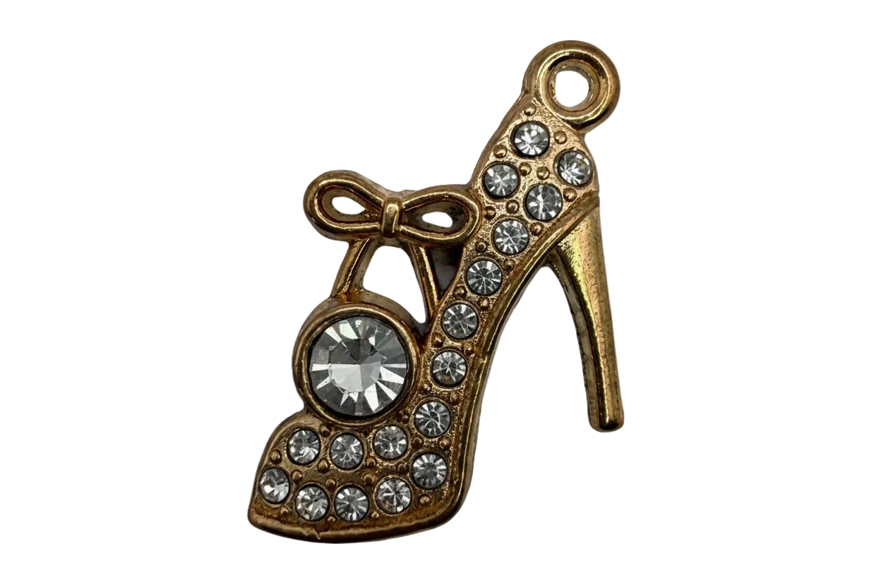 Gold high-heel shoe charm with bow and clear rhinestones, featuring a large faceted clear gem