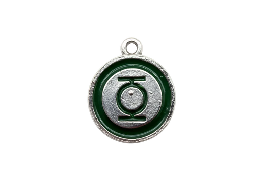 Round silver disc with deep green enamel ring and raised graphic emblem