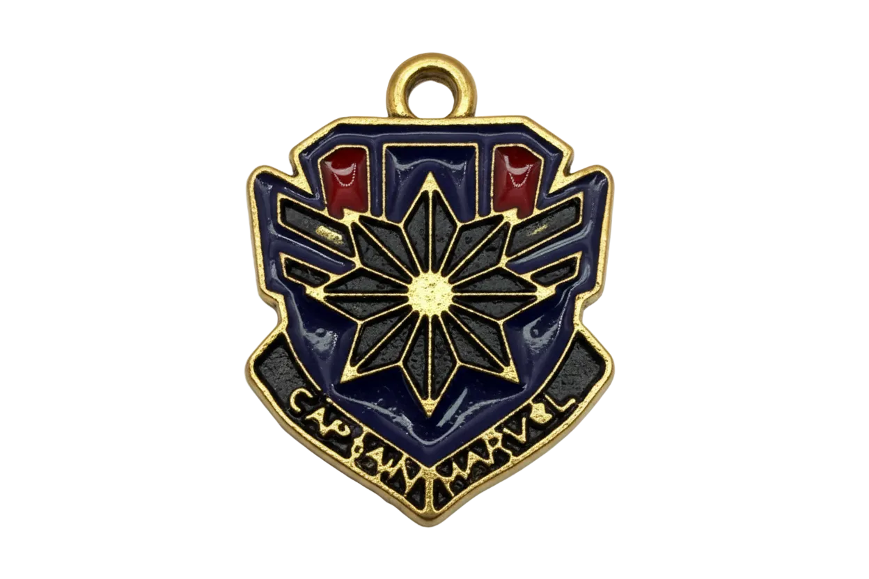 Gold-tone shield emblem with navy enamel, black starburst center, and small red accents