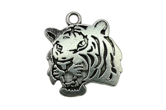 Antique silver tiger head charm with recessed line detailing and a small clear gem accent
