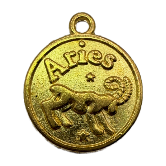 Gold round Aries zodiac coin medallion with raised ram and stars