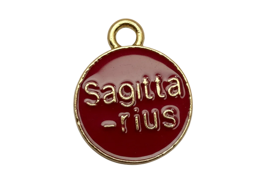 Round red enamel Sagittarius zodiac disc with raised gold lettering and gold border