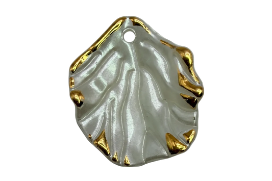 Pearlescent ivory leaf with sculpted veins and polished gold edge accents