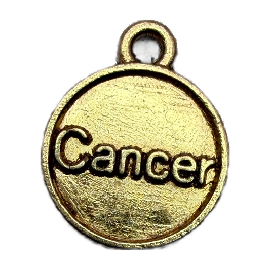 Gold round medallion with raised Cancer zodiac lettering and antiqued texture