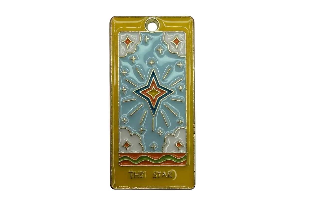 Gold rectangular tarot card charm with sky-blue enamel, central star motif, and THE STAR text