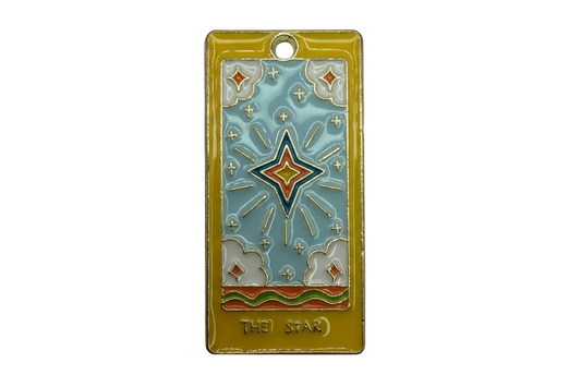 Gold rectangular tarot card charm with sky-blue enamel, central star motif, and THE STAR text