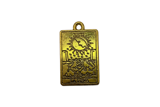 Gold rectangular moon tarot card charm with engraved wolves, crescent moon, and "LA LUNA" text