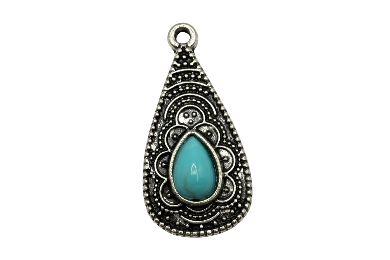 Ornate silver-toned teardrop charm with filigree detail and glossy turquoise teardrop gem