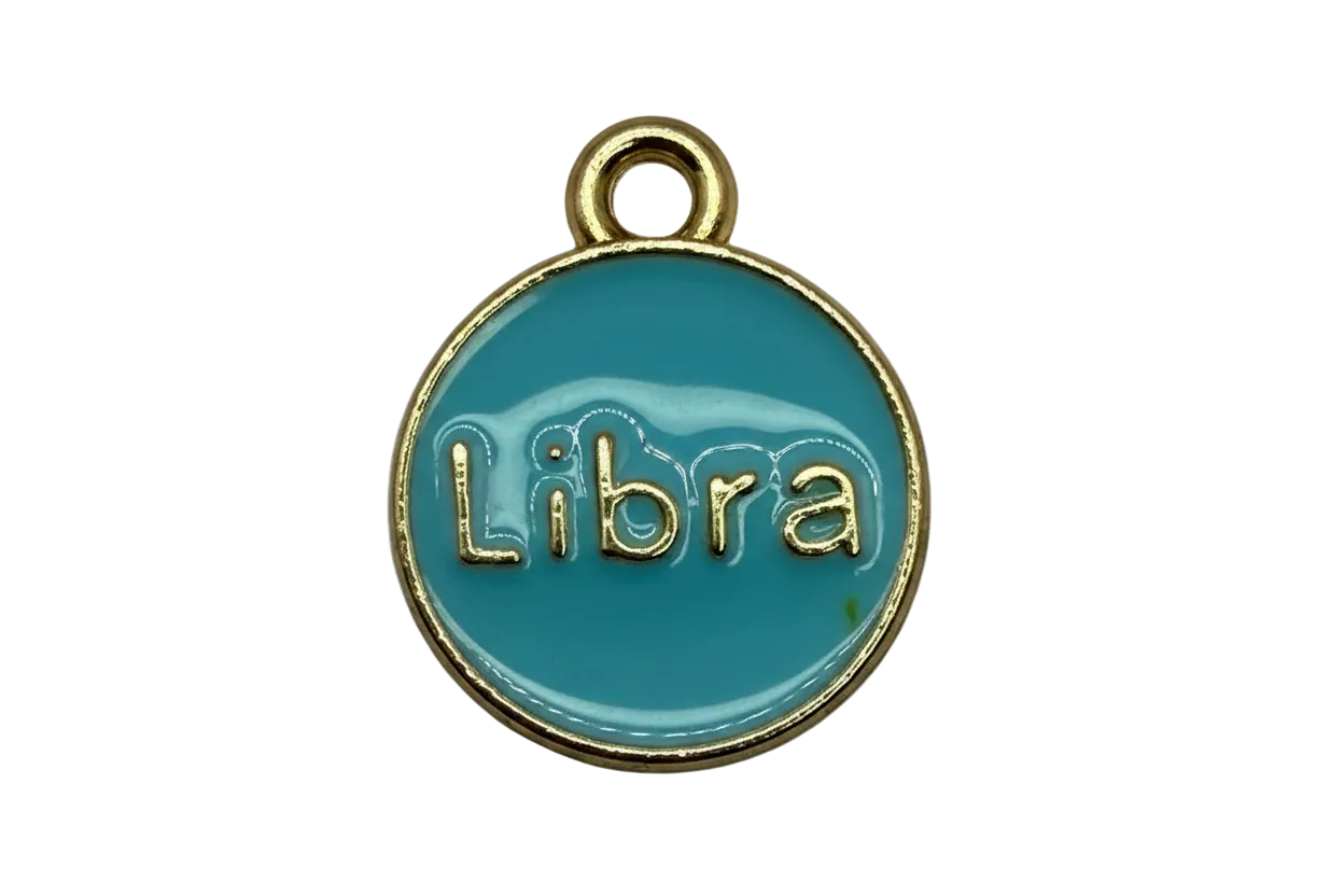 Teal round zodiac disc with raised gold Libra lettering and a gold rim