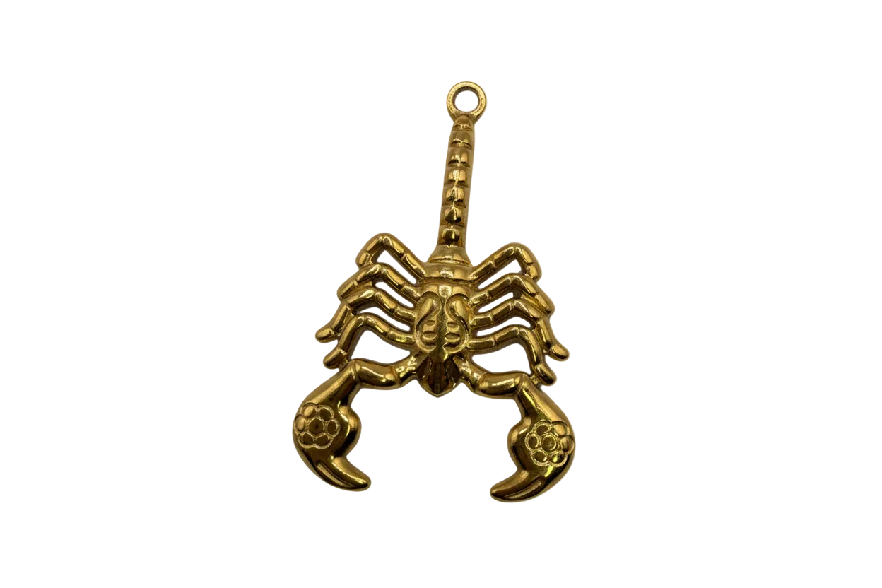 Gold sculpted scorpion with arched tail and detailed pincers