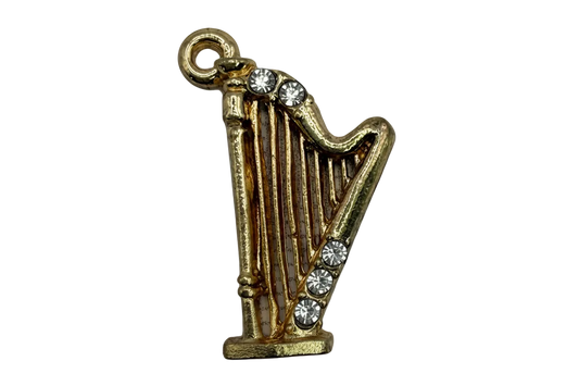 Gold harp charm with clear crystal accents and detailed strings