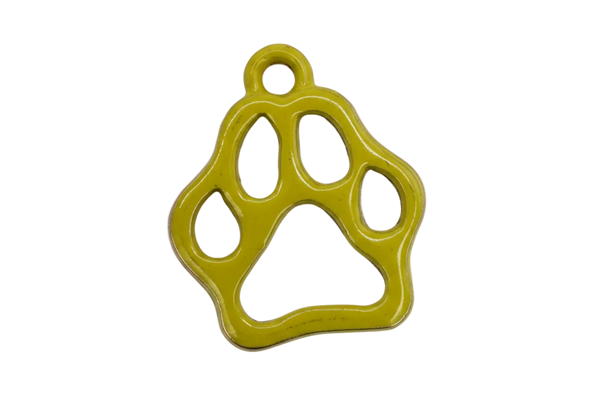 Glossy yellow paw print outline charm with cutout pads on gold-tone base