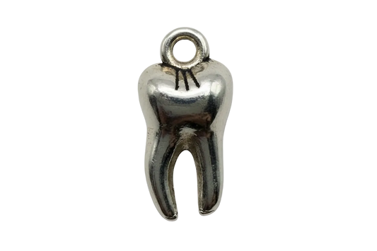 Polished silver-tone molar tooth charm with darkened details on a black background
