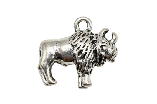 Antiqued silver shaggy terrier dog figure with raised tail and textured fur
