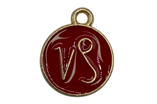 Round burgundy enamel medallion with raised gold VS monogram