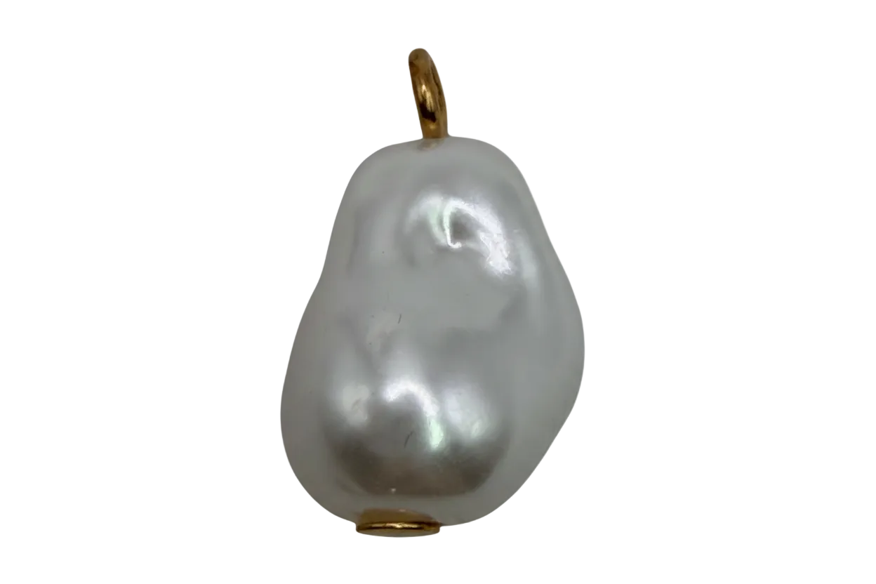 Lustrous baroque white pearl pendant with gold accents on black background