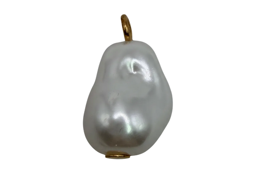 Lustrous baroque white pearl pendant with gold accents on black background