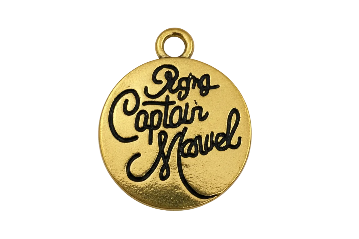 Round gold disc with raised black script lettering and a small top ring