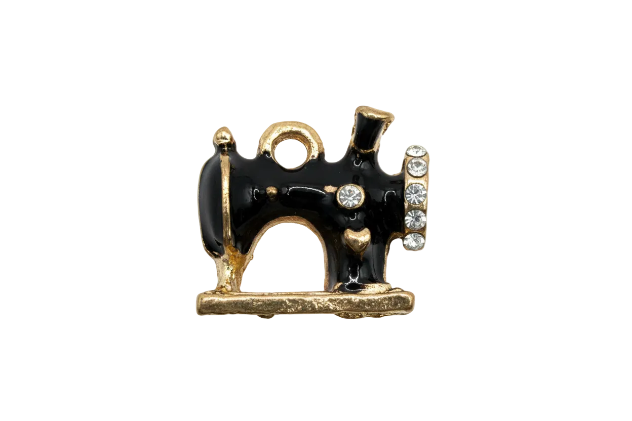 Black enamel vintage sewing machine charm in gold with clear crystals and white accents