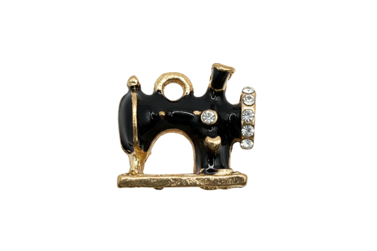 Black enamel vintage sewing machine charm in gold with clear crystals and white accents