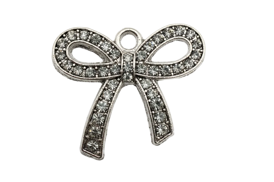 Silver ribbon bow charm with clear pavé crystals and oxidized detailing