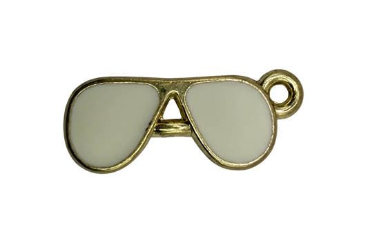 Gold musical note charm with glossy white enamel inlay
