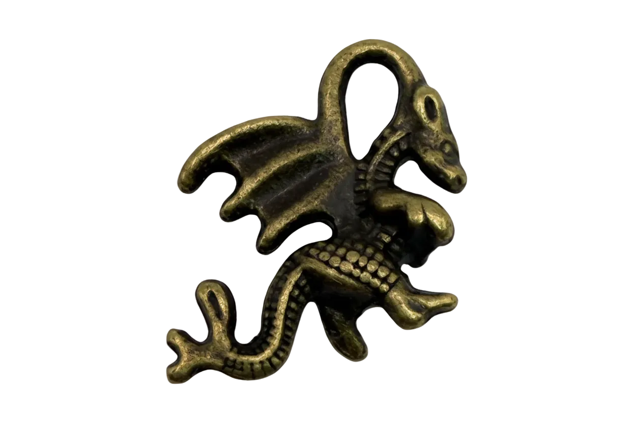 Antiqued gold winged dragon charm with curled tail and sculpted scales