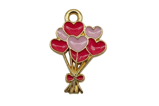 Gold heart balloon bouquet with glossy red and blush pink enamel hearts and a red bow