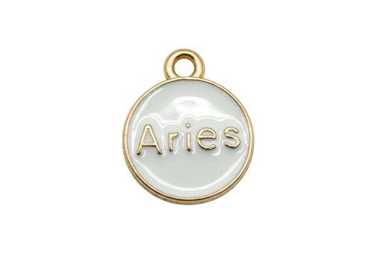 White round Aries zodiac disc with raised gold lettering and gold trim