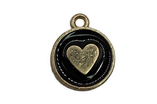 Round gold medallion with glossy black enamel and a raised textured gold heart