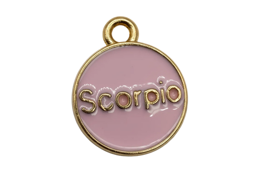 Lavender round Scorpio zodiac disc with raised gold lettering and gold edge