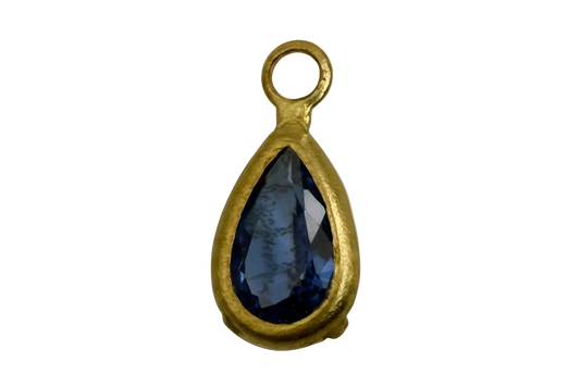 Gold teardrop charm with faceted midnight-blue gem