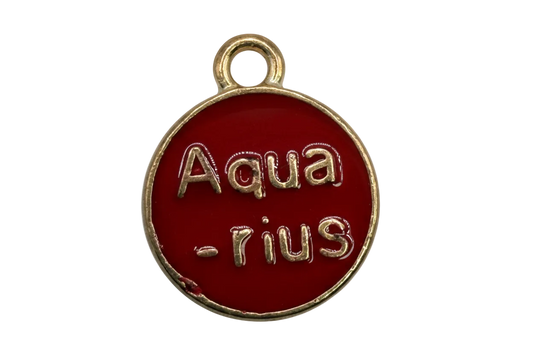 Round glossy red enamel coin medallion with raised gold lettering and gold rim