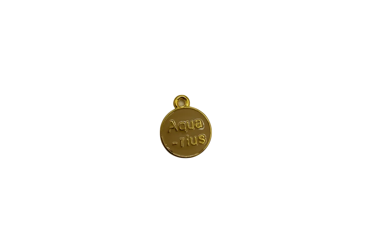 Tan “sin paura” round token with gold rim