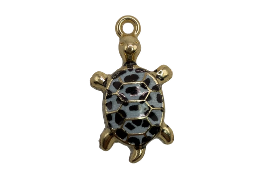 Gold turtle charm with slate-blue enamel shell and black spotted pattern