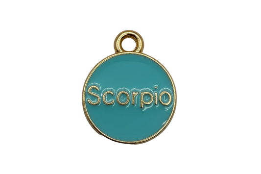 Teal enamel Scorpio zodiac disc with gold border and small clear gem accent