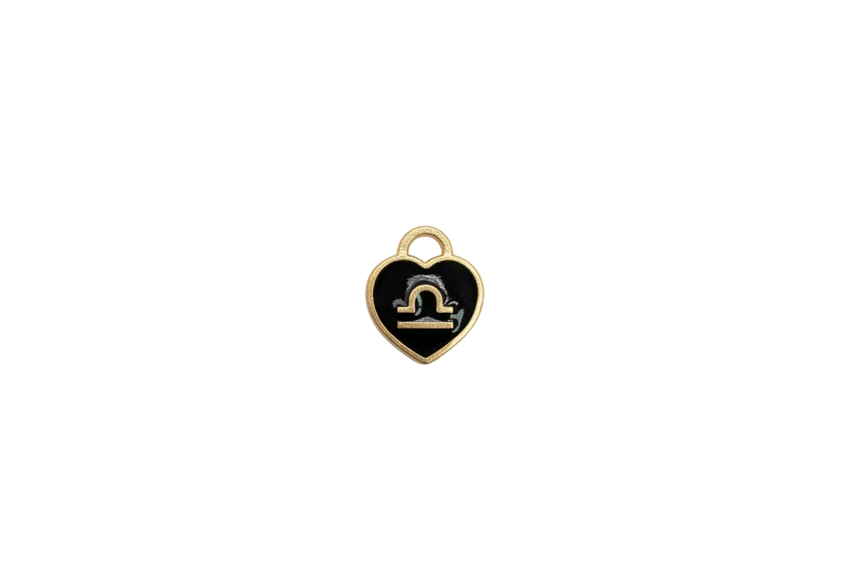 Black Capricorn medallion with gold symbol and white stone