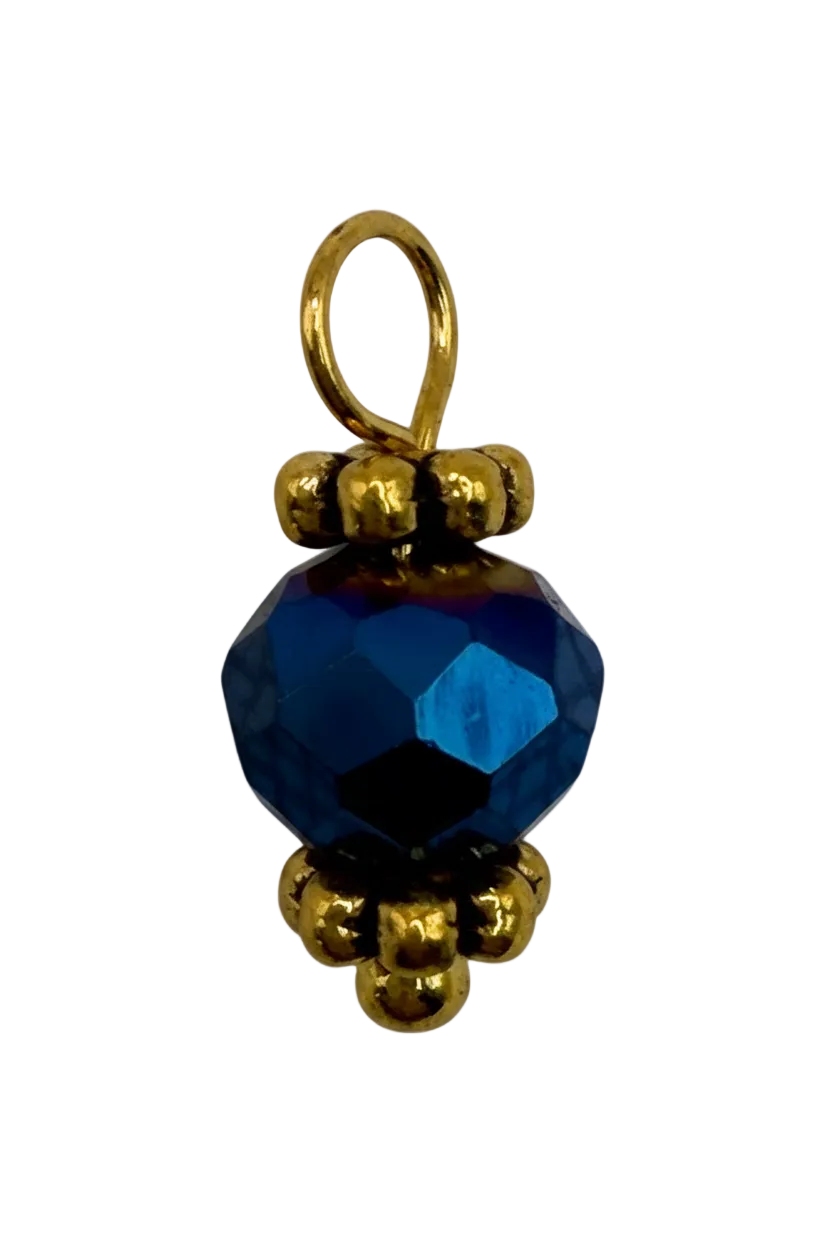 Faceted sapphire-blue bead gem with polished gold beaded accents
