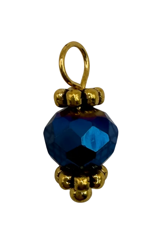 Faceted sapphire-blue bead gem with polished gold beaded accents