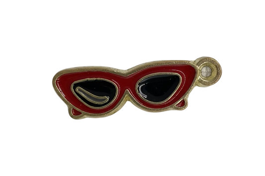 Red cat-eye sunglasses charm with black lenses, gold outline, and a small clear stone accent