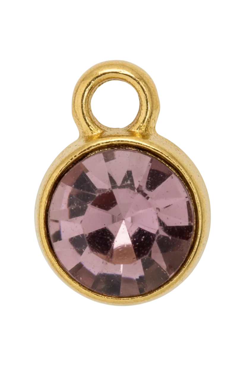 Faceted mauve round gem in a smooth gold frame