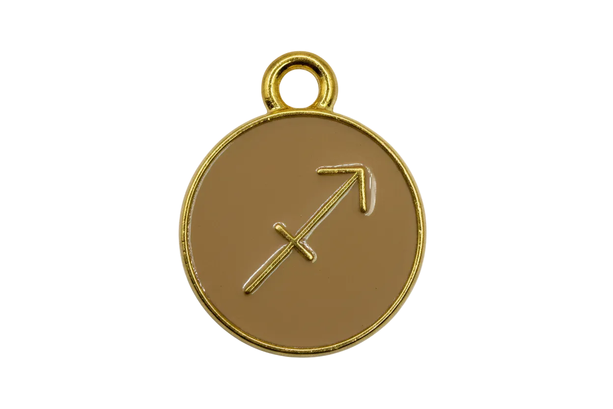 Tan round zodiac disc with Sagittarius arrow symbol and polished gold rim