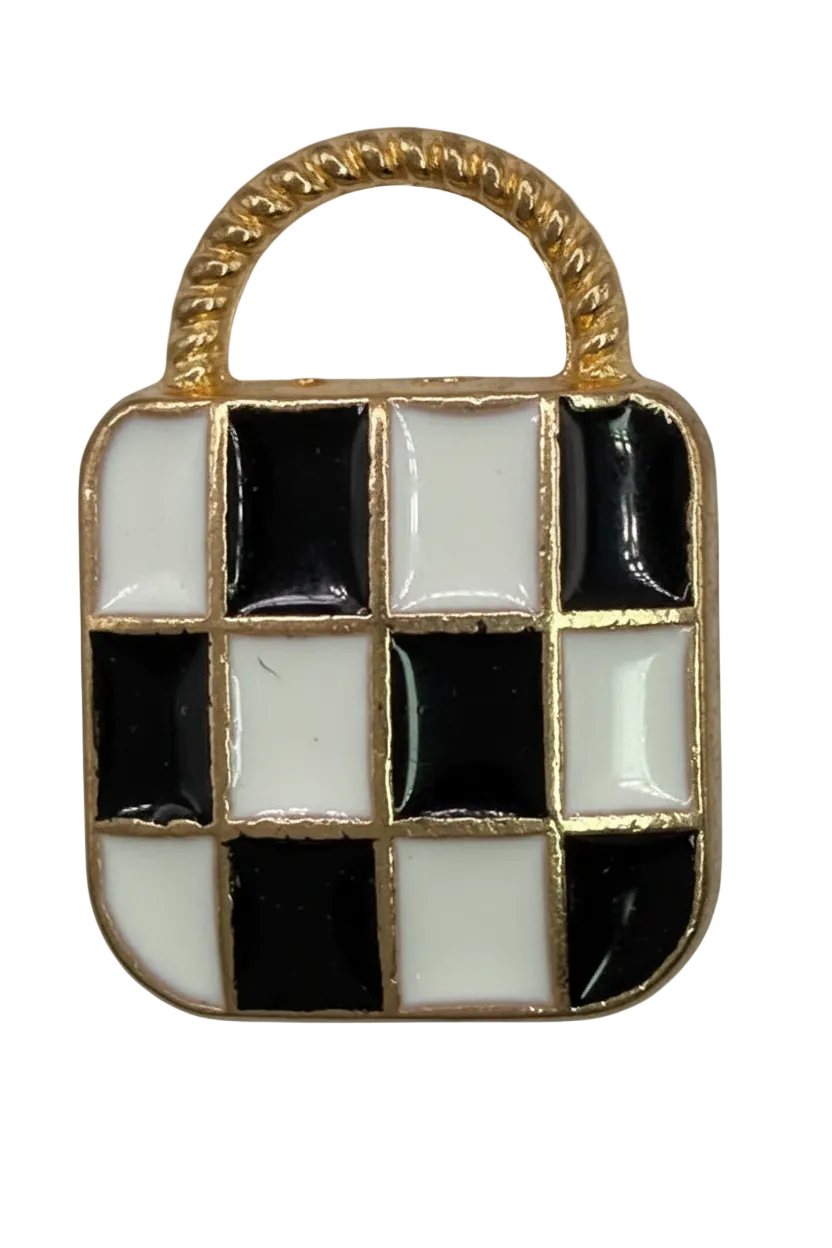 Gold slipper charm with black and white checkered enamel and a patterned white toe