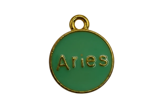 Green enamel Aries medallion with raised gold lettering and gold rim