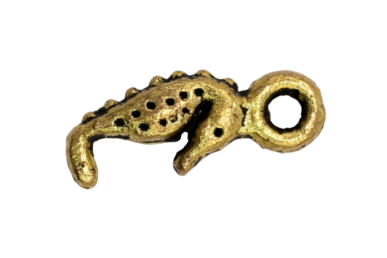 Gold octopus tentacle charm with textured finish and raised suction cups