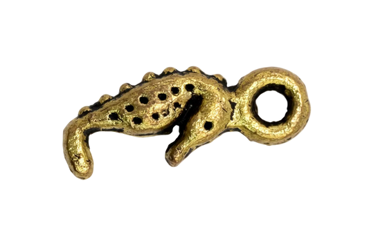 Gold octopus tentacle charm with textured finish and raised suction cups