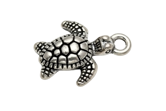 Textured sea turtle charm in antiqued silver with dark recessed detailing