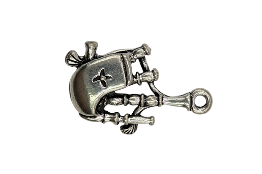 Antique silver wind-up robot charm with sculpted mechanical details on a black background