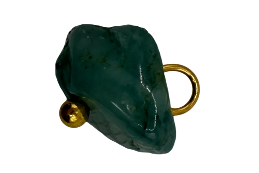 Polished deep green elephant head with gold accents on black background